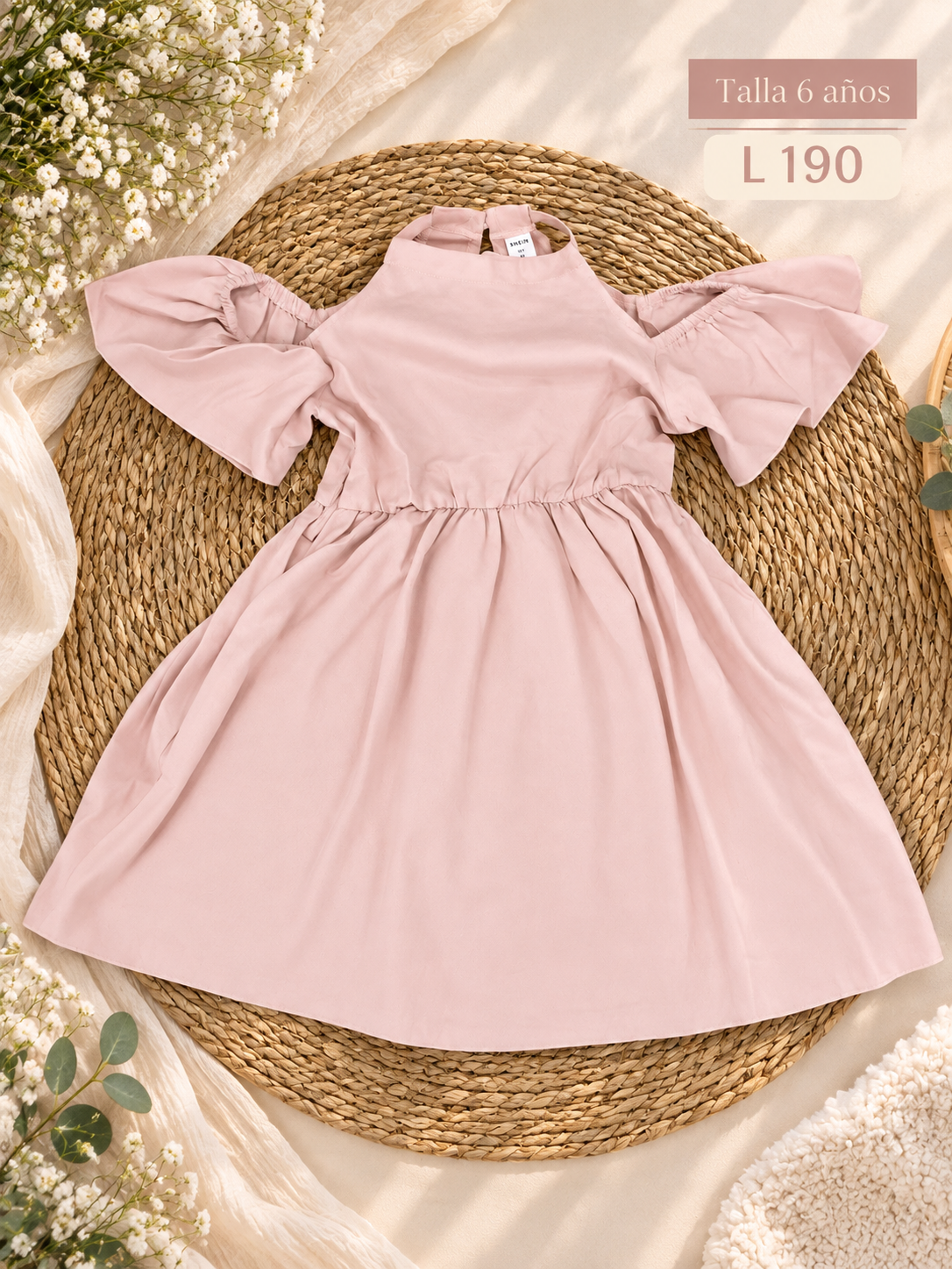 Vestido rosa para niña con detalles de mangas abullonadas con volantes