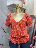 Blusa estilo peplum con estampado floral de mangas abombadas