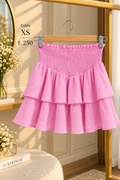 Mini falda rosada de doble capa con volantes
