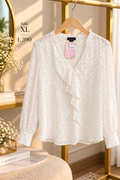 Blusa elegante de manga larga con sutil estampado de lunares