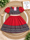 Vestido rojo para niña con mangas abullonadas y un llamativo estampado