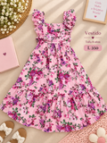 Tierno vestido para niña de color rosa con estampado floral y tirantes con volantes