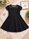 Vestido negro para niña de corte en A con detalles de malla transparente de lunares